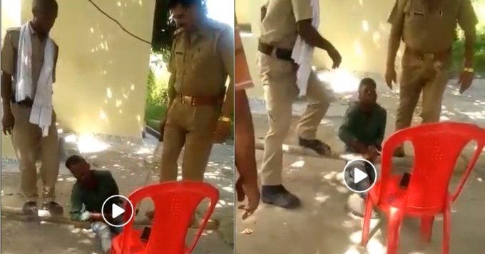 Policemen torturing man